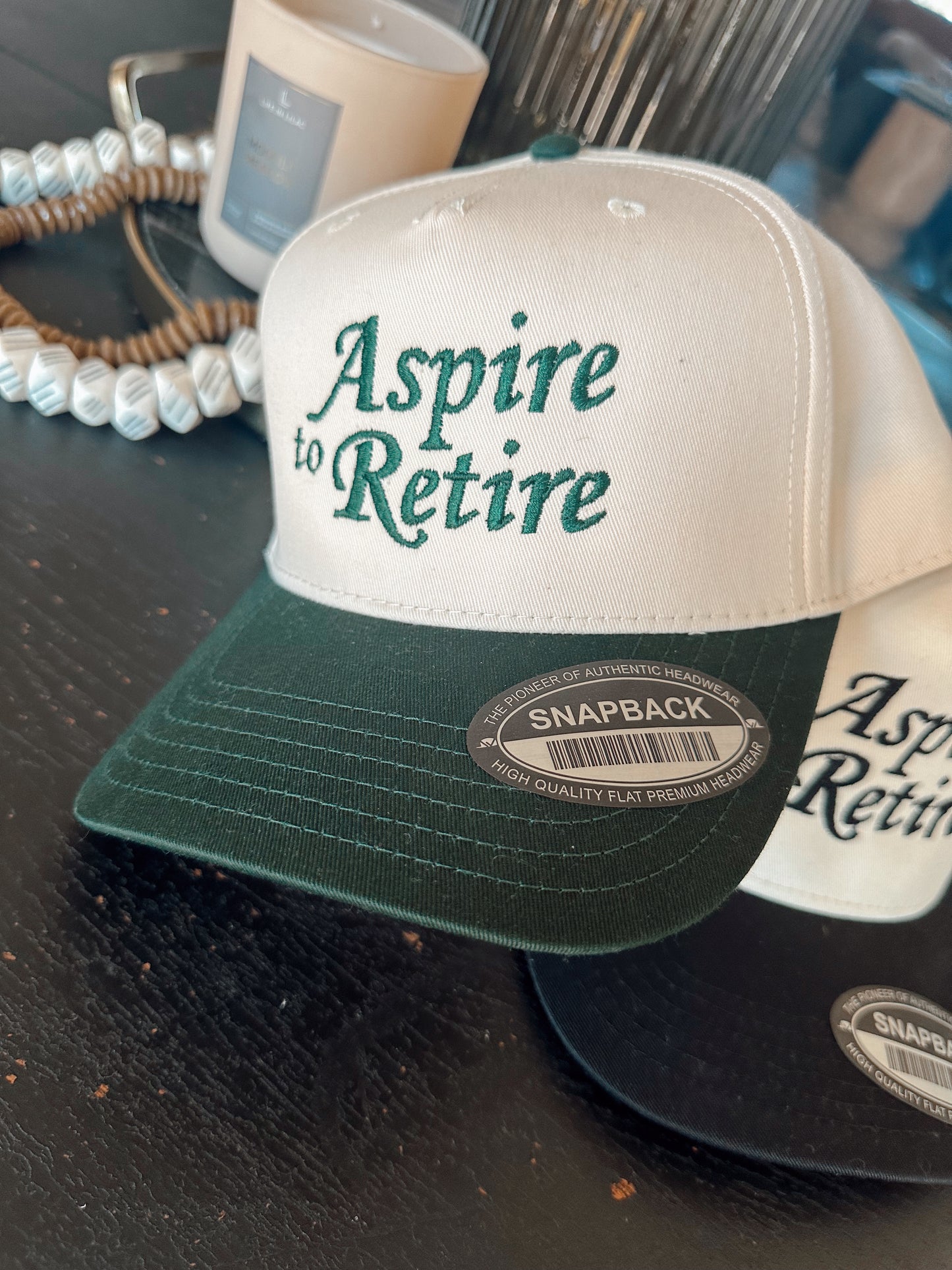 Aspire to Retire Trucker Hat